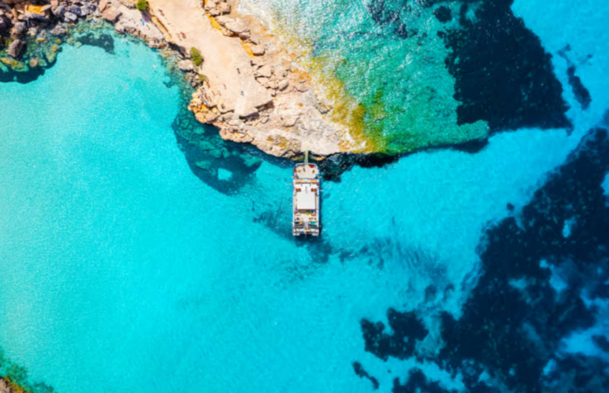 Ibiza beach hopping and paddle cruise experience with drinks included along the coastline
