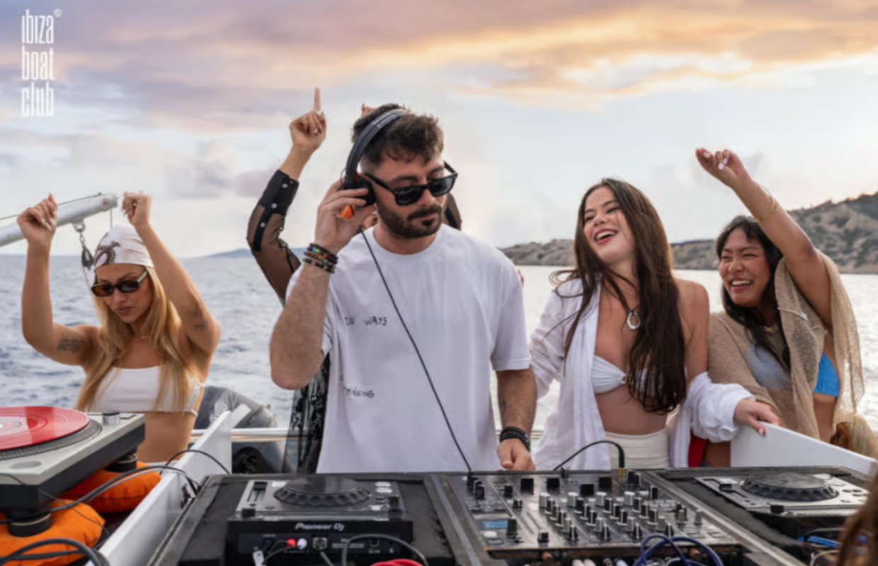 Ibiza boat party with DJ music club atmosphere and open bar experience